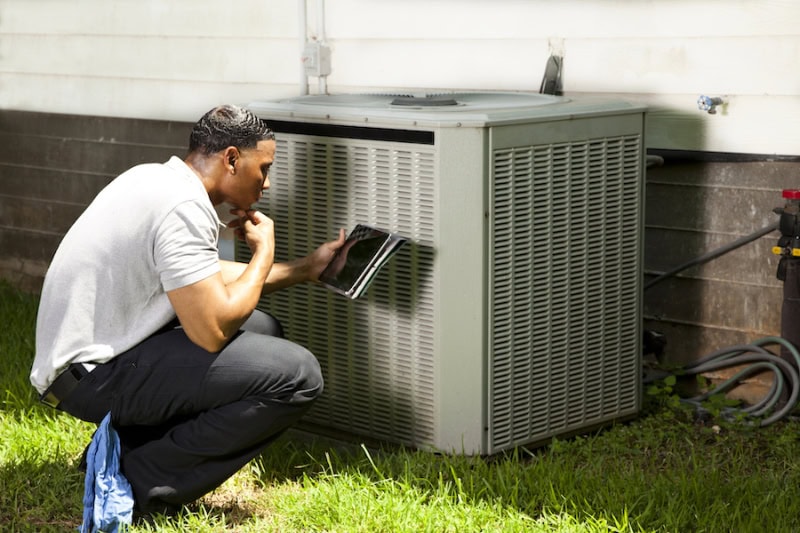 3 Tips to Prevent an AC Breakdown During a Heat Wave. AC tech.