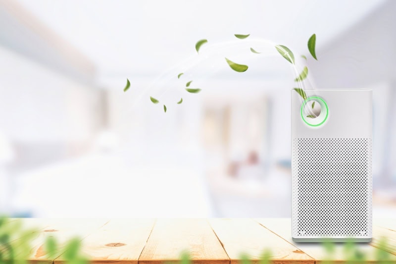 What Do Air Purifiers and Air Filters Do? Air purifier a living room, removing dust in house.